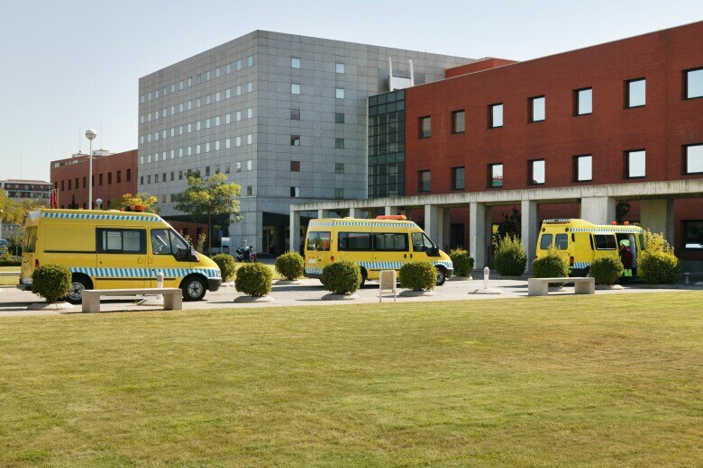 Ambulance vehicles on an hospital parking. Emergency transport. Medicine