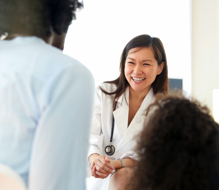 Female doctor speaking with patient
