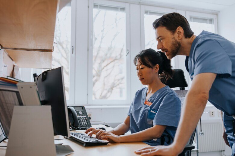 Medical Professionals Working On Computer