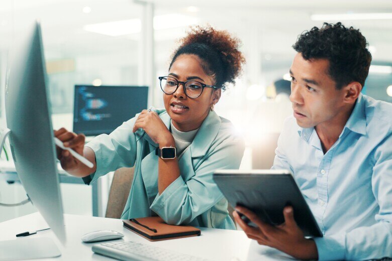 Computer, tablet and research with business people in office.