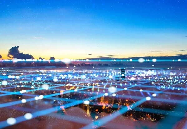 blue rays of light forming a grid over an urban landscape