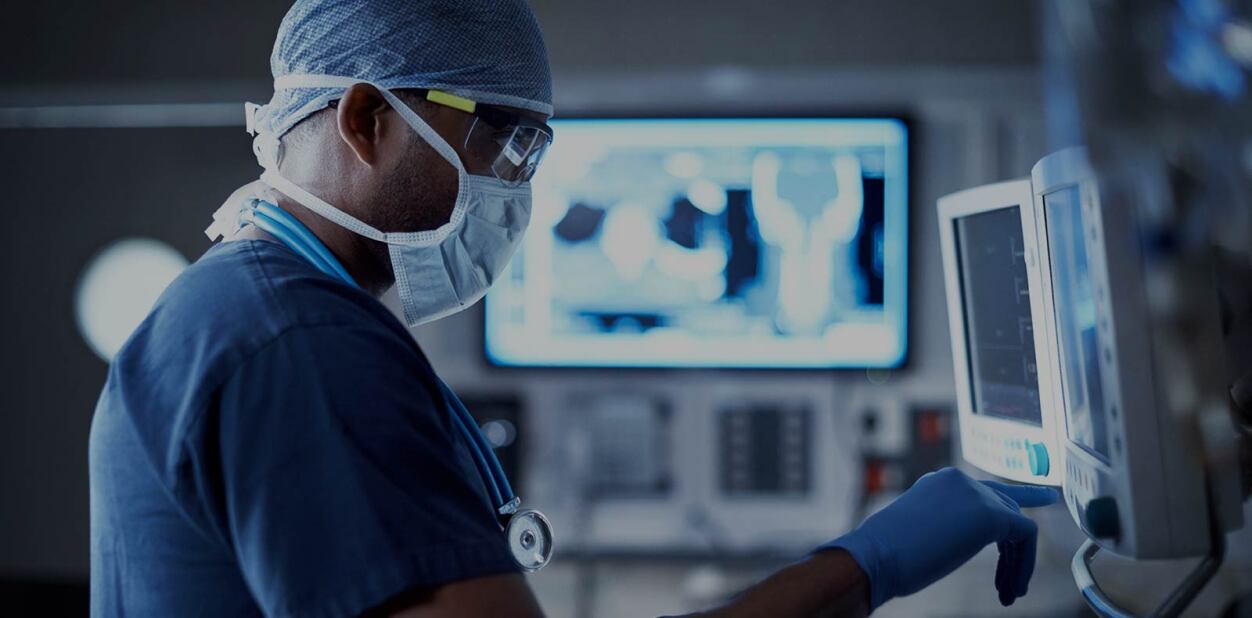 medical professional setting up monitors