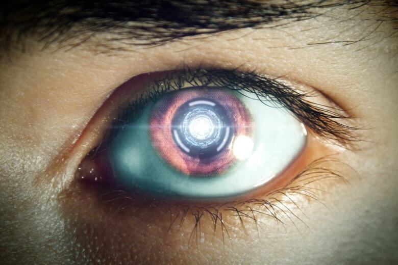 reflection of glowing orb in a human eye