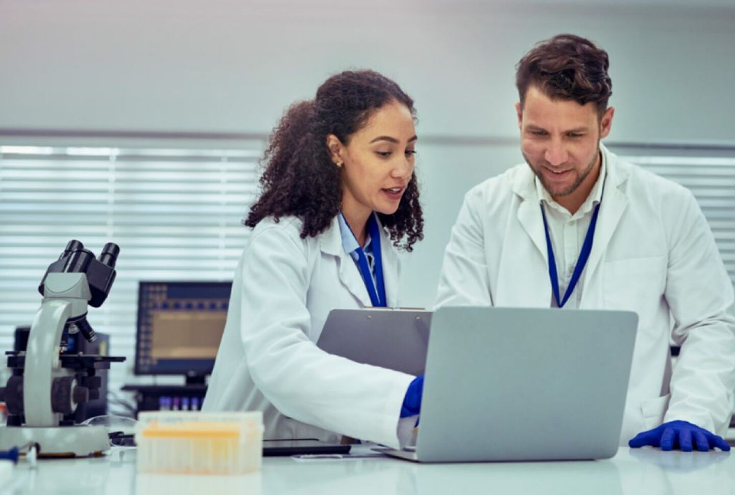 Lab Technicians at laptop 