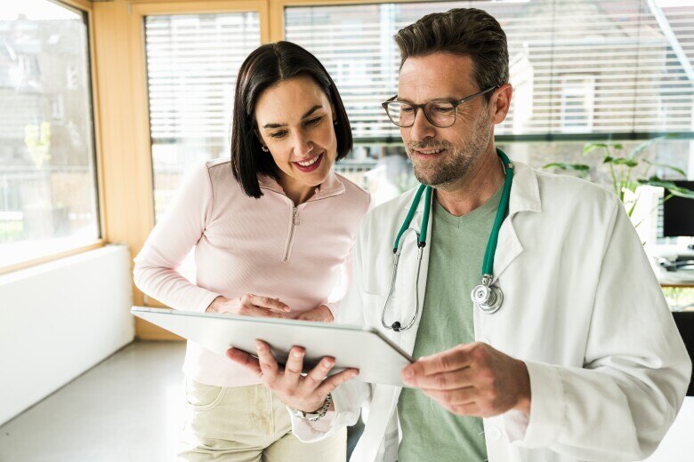 Doctor and patient looking at ipad