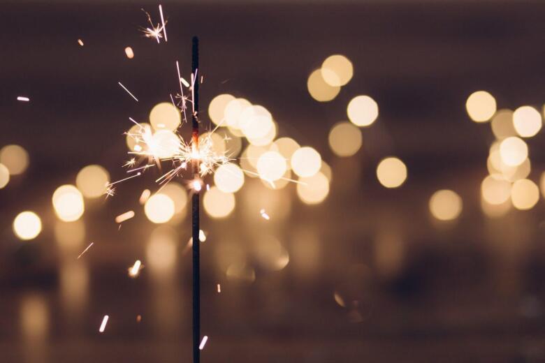 sparkler sparking in front of blurred background