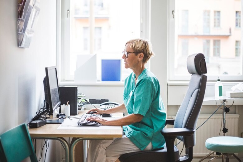 nurse working on a computer in her office