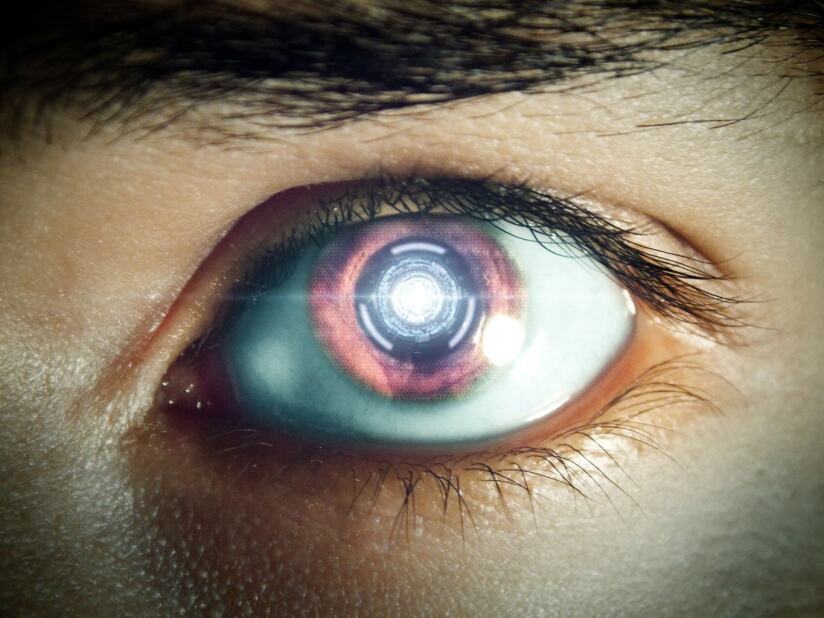Close-up of a human eye with a graphic superimposed over the pupil, depicting artificial intelligence