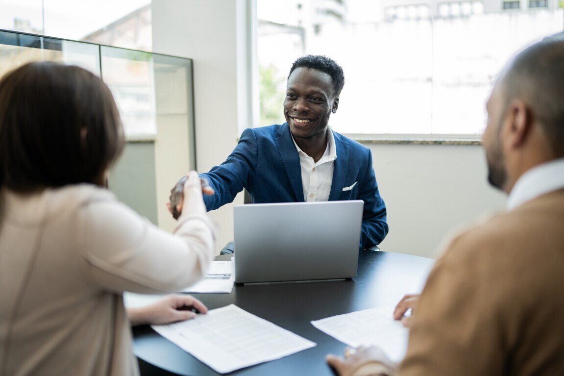 Customer shaking hands with salesman, financial customer