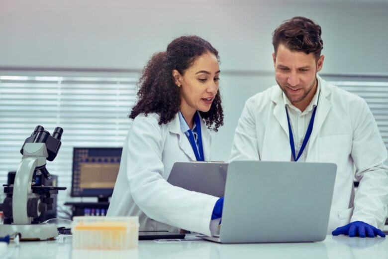 Lab Technicians at laptop