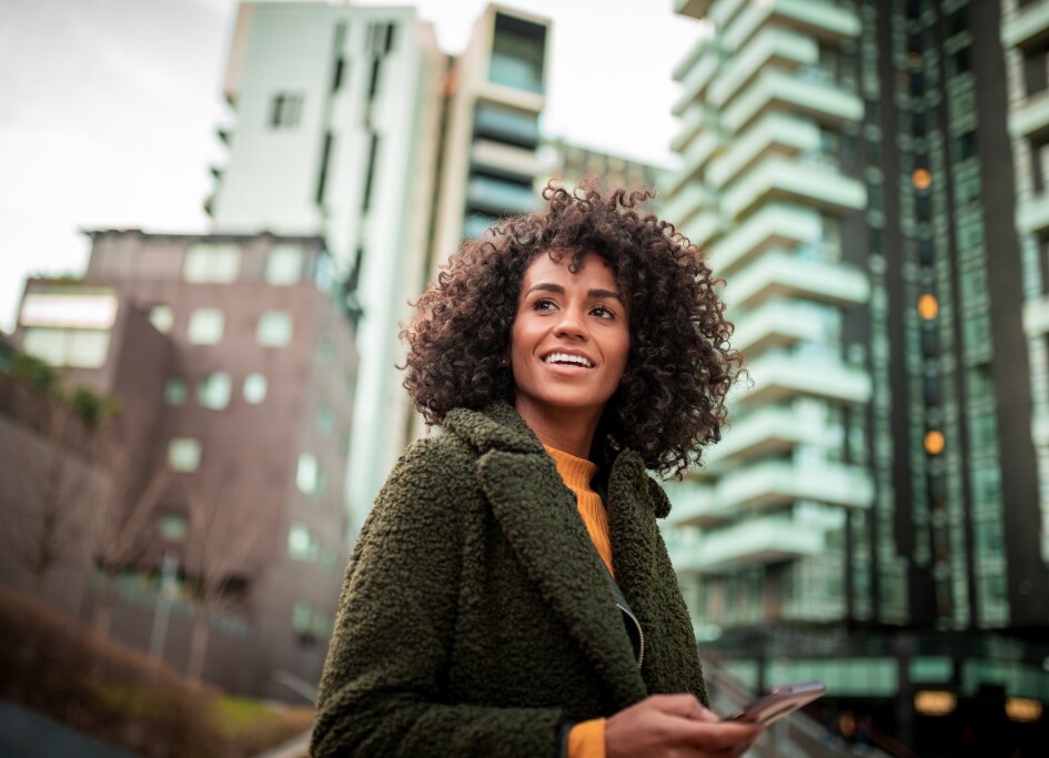 A smiling young woman at the downtown district