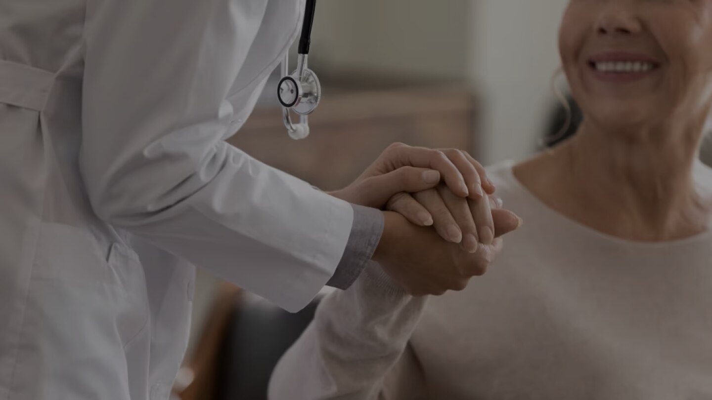 Female Physician Holding Patient's Hand