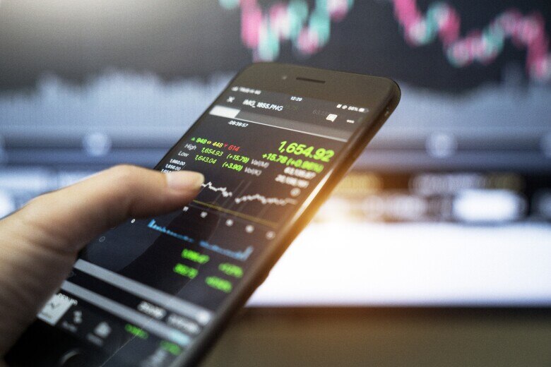 smartphone with financial charts