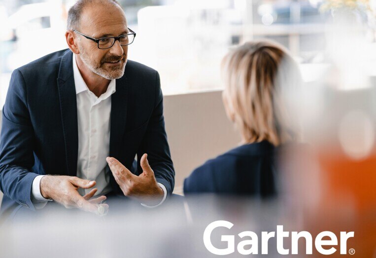 Gartner business analysts having a discussion