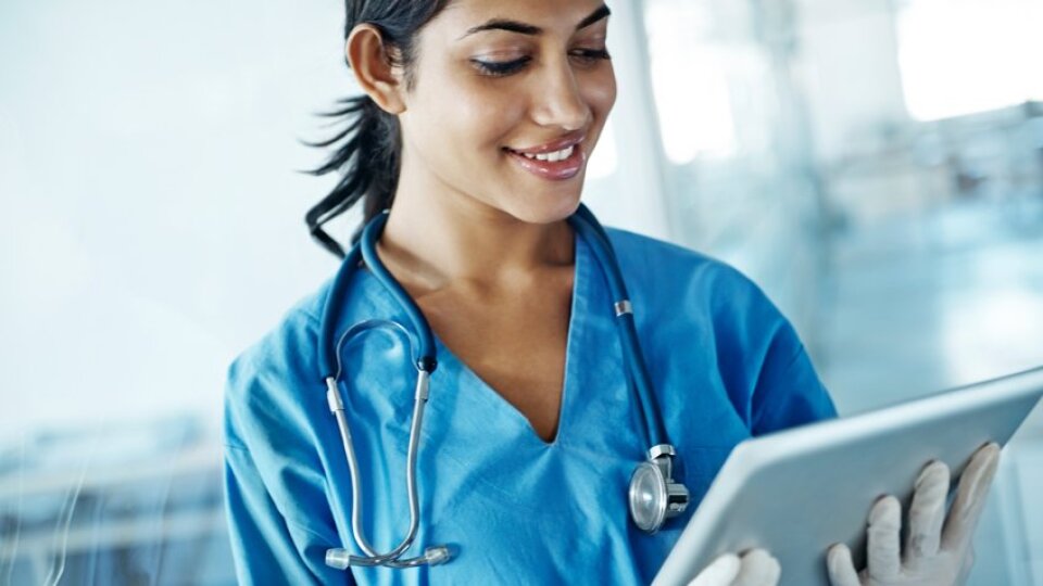 female doctor on tablet