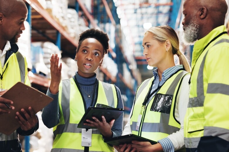 4 people in a warehouse