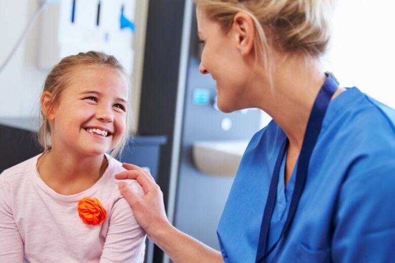Female Nurse with Child