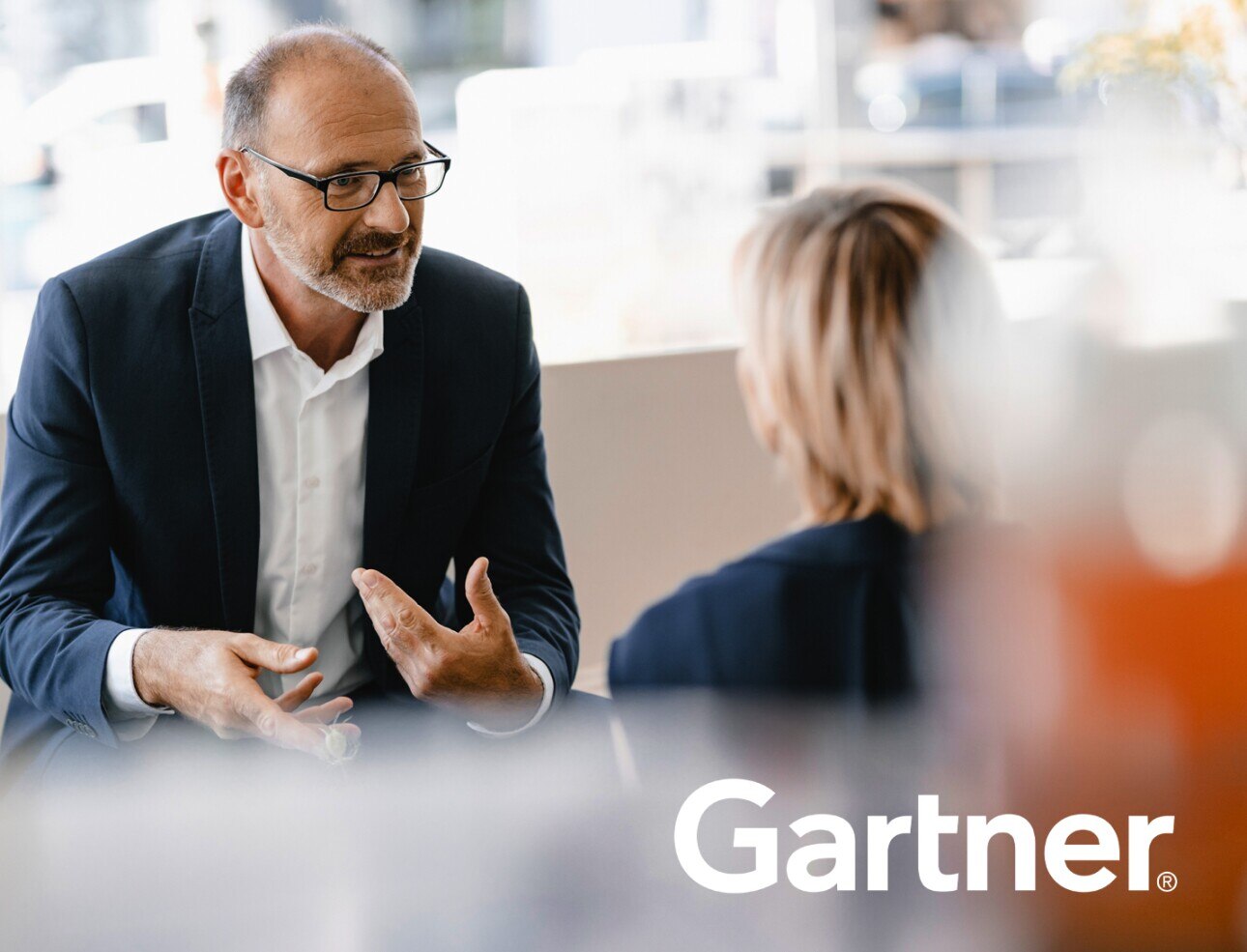 Gartner business analysts having a discussion