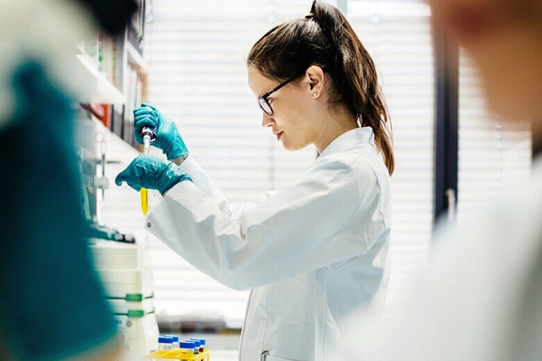 young scientist preparing a sample in a medical laboratory