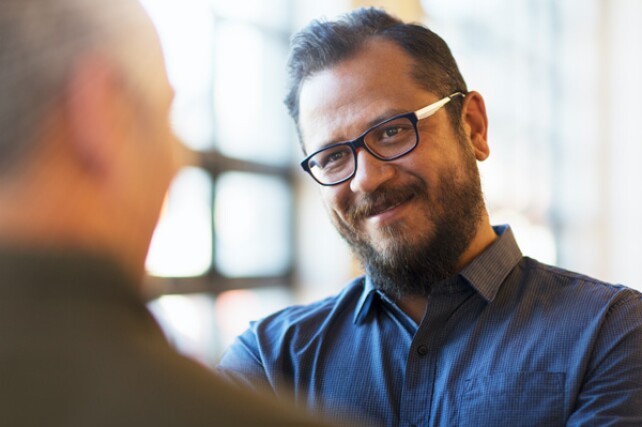 analyst having a conversation with a business partner