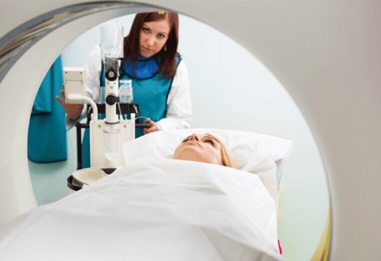 medical technician taking an MRI of a patient