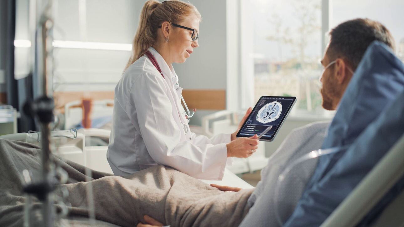 Bedside Doctor and Patient with ipad